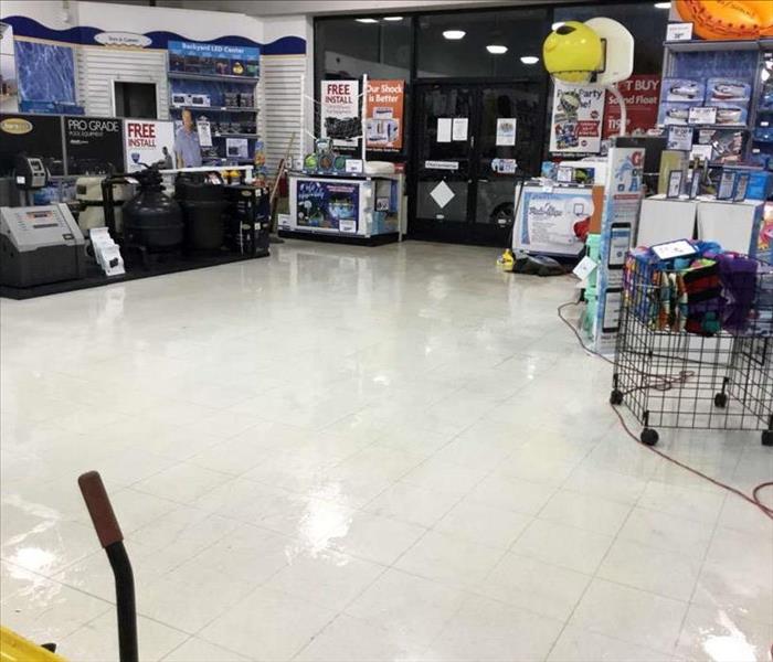 commercial store with water all over the ground