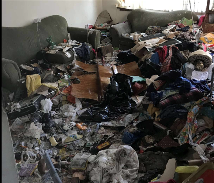 room filled with hoarding debris, no visible floor