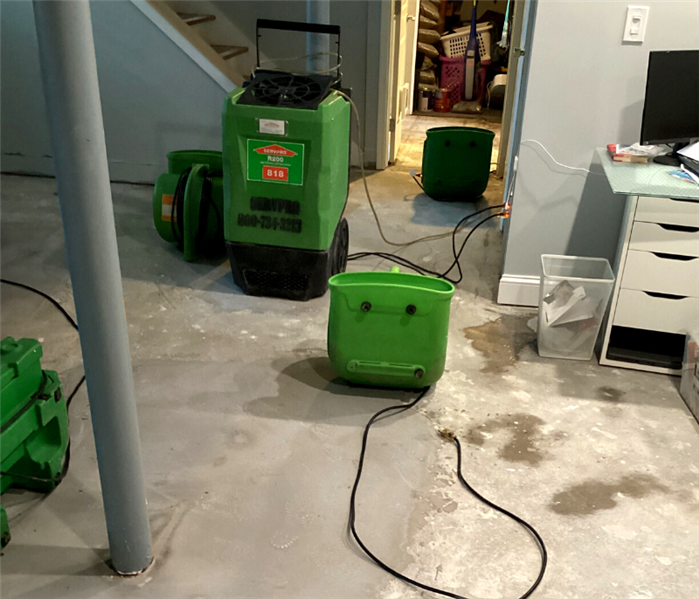 Burst water heater flood cleanup near me in Guilford, CT.