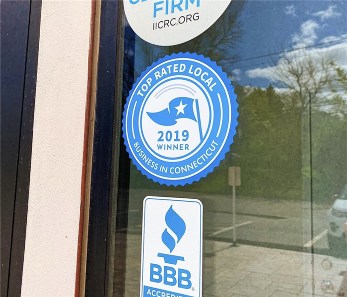 Better Business Bureau seal on SERVPRO Branford/Shoreline window. 